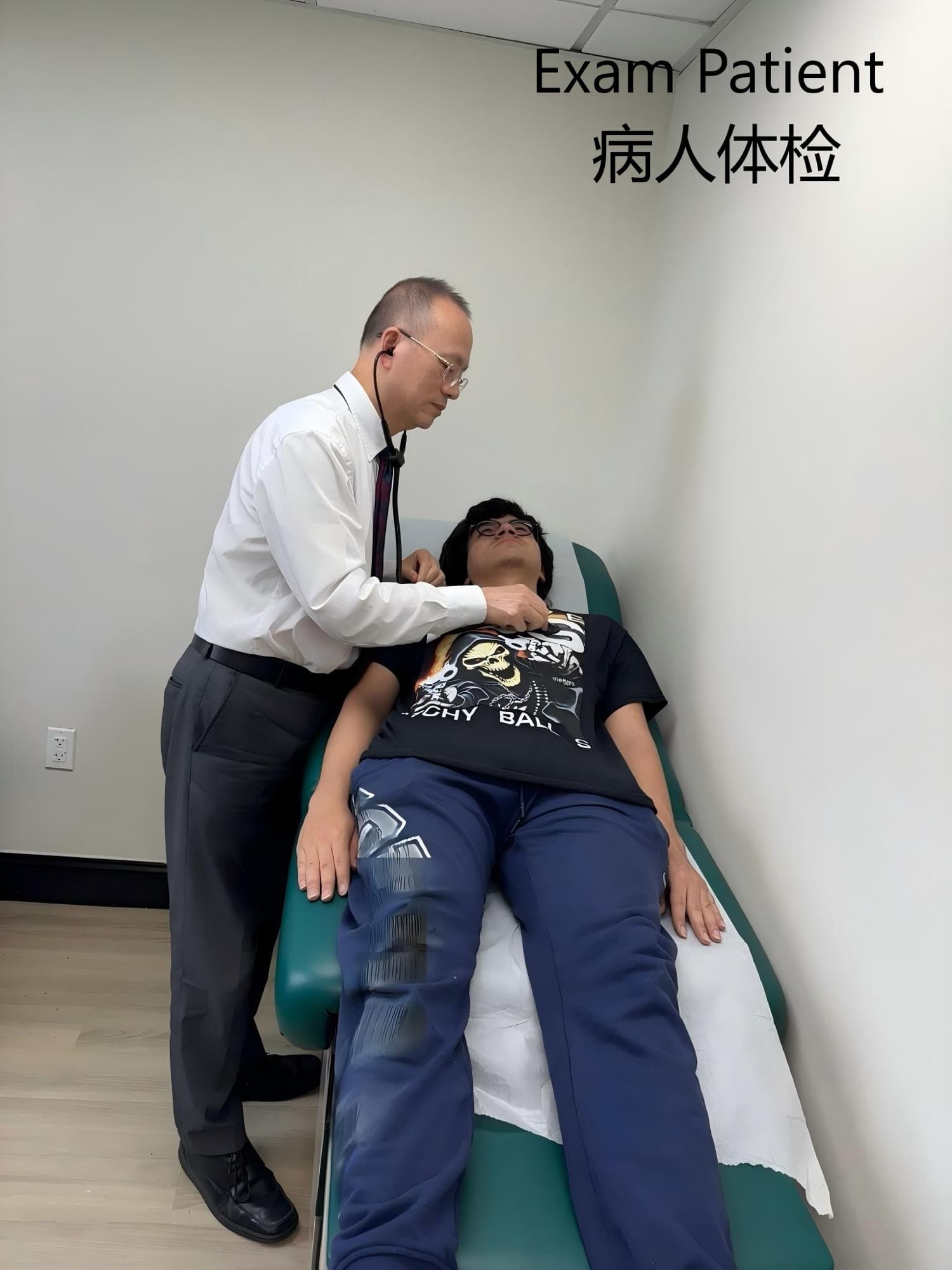 Dr. Lee in a white shirt using a stethoscope on a patient lying down during a physical